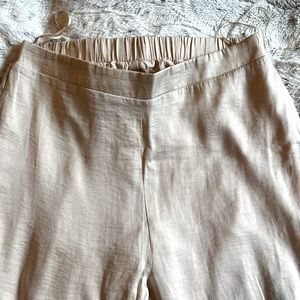 Wide leg flowy satin pants.